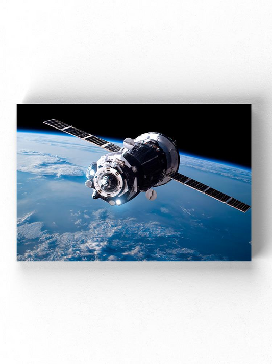 A Satellite Orbiting Earth Wrapped Canvas -Image by Shutterstock