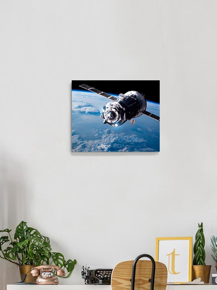 A Satellite Orbiting Earth Wrapped Canvas -Image by Shutterstock