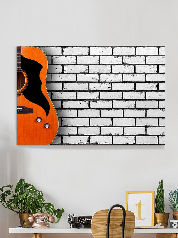 Acoustic Guitar On Wall Wrapped Canvas -Image by Shutterstock