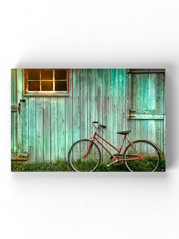 Bicycle Leaing Against A Wall Wrapped Canvas -Image by Shutterstock