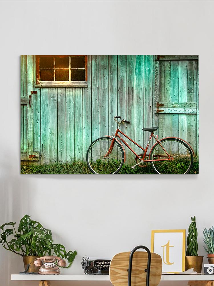 Bicycle Leaing Against A Wall Wrapped Canvas -Image by Shutterstock