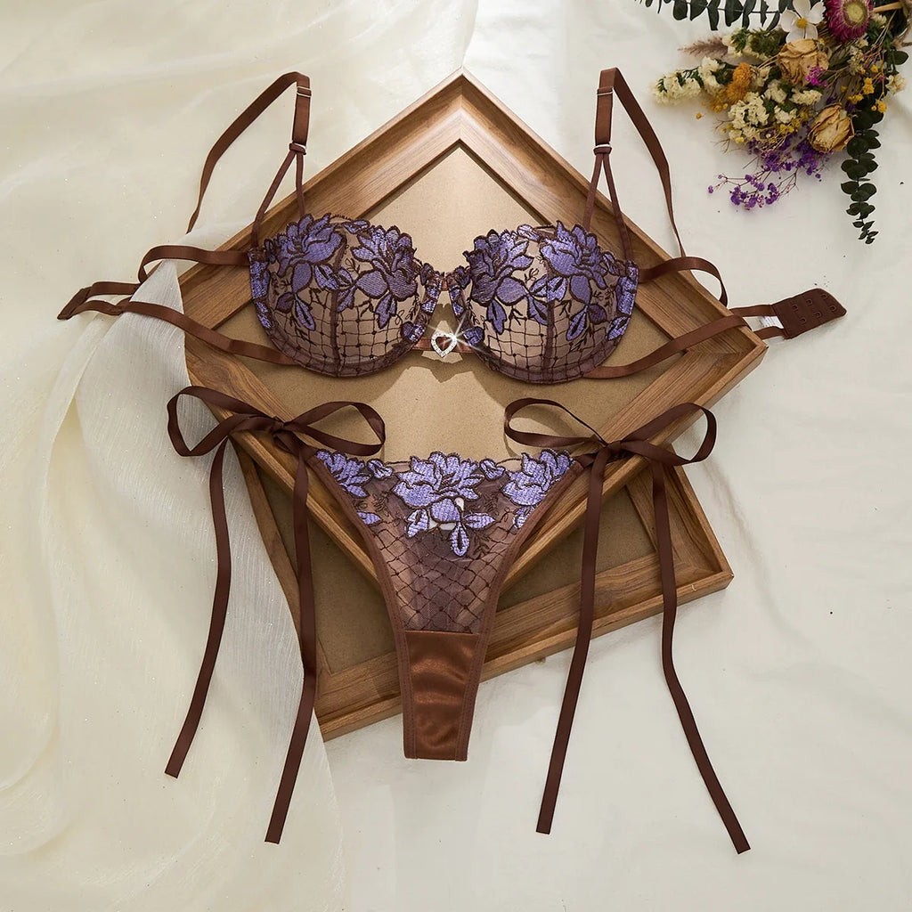 A limited edition brown and purple lace lingerie set with rose embroidery, see-through netting bra, and tie-up thong ZA825200