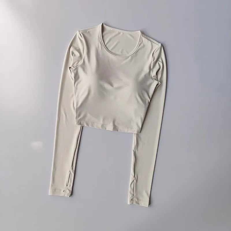 Women's long sleeved yoga suit sports top, high-end tight fitting hollow back fixed chest cushion