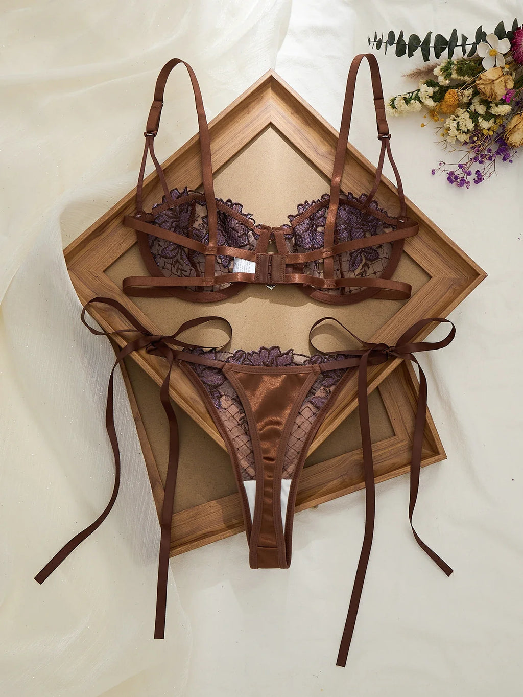 A limited edition brown and purple lace lingerie set with rose embroidery, see-through netting bra, and tie-up thong ZA825200