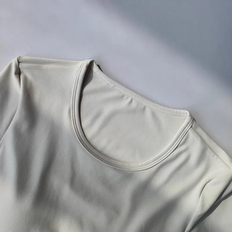 Women's long sleeved yoga suit sports top, high-end tight fitting hollow back fixed chest cushion