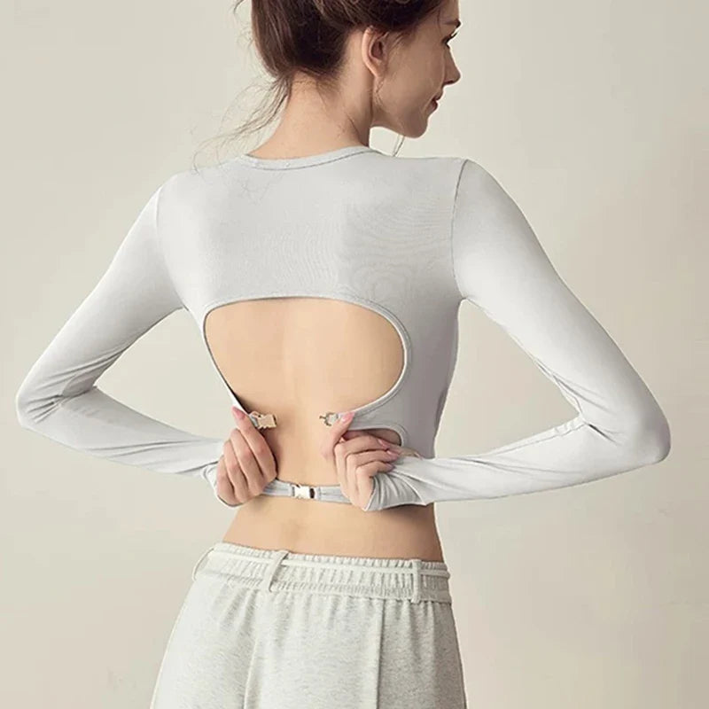 Women's long sleeved yoga suit sports top, high-end tight fitting hollow back fixed chest cushion