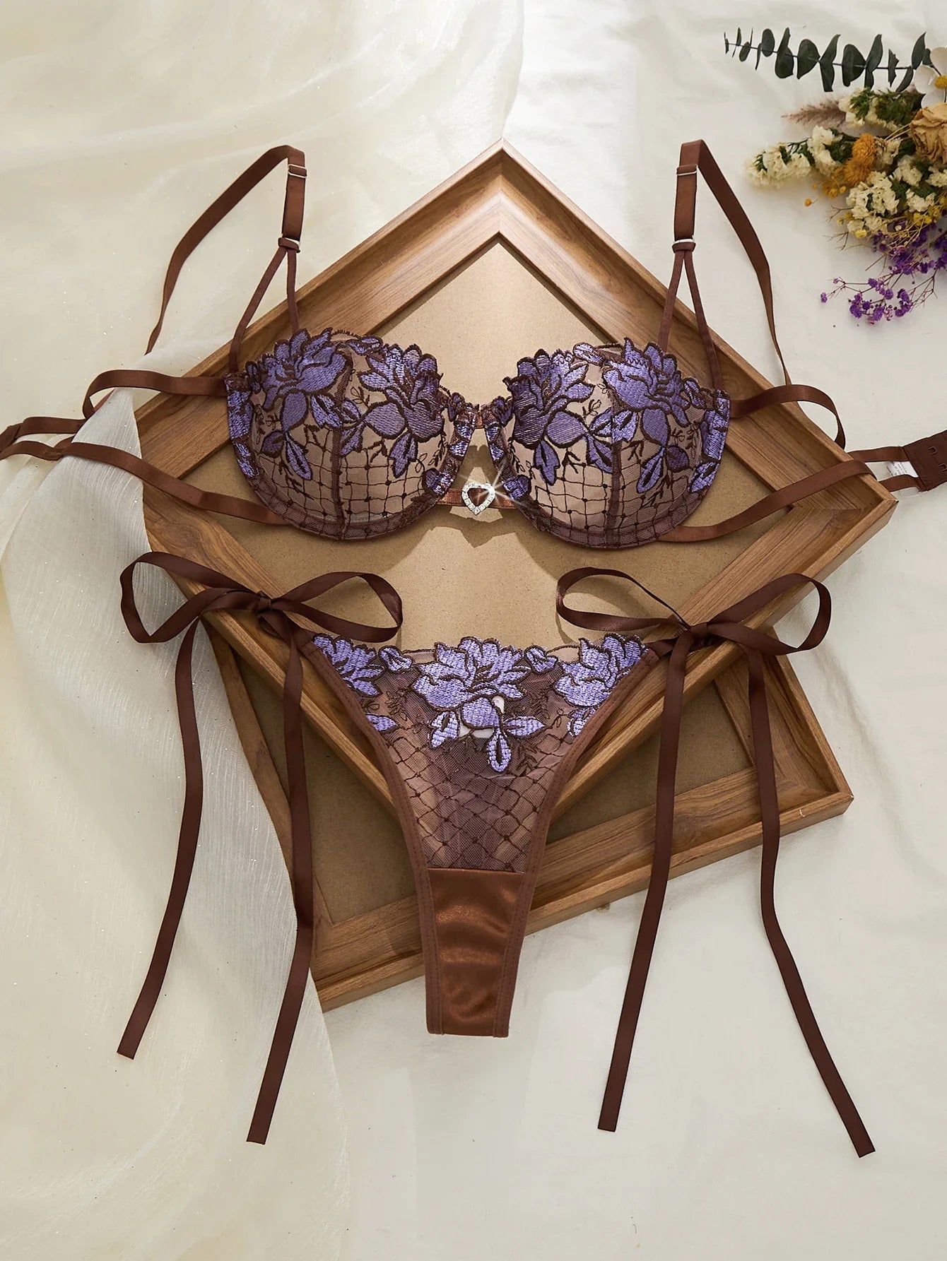 A limited edition brown and purple lace lingerie set with rose embroidery, see-through netting bra, and tie-up thong ZA825200