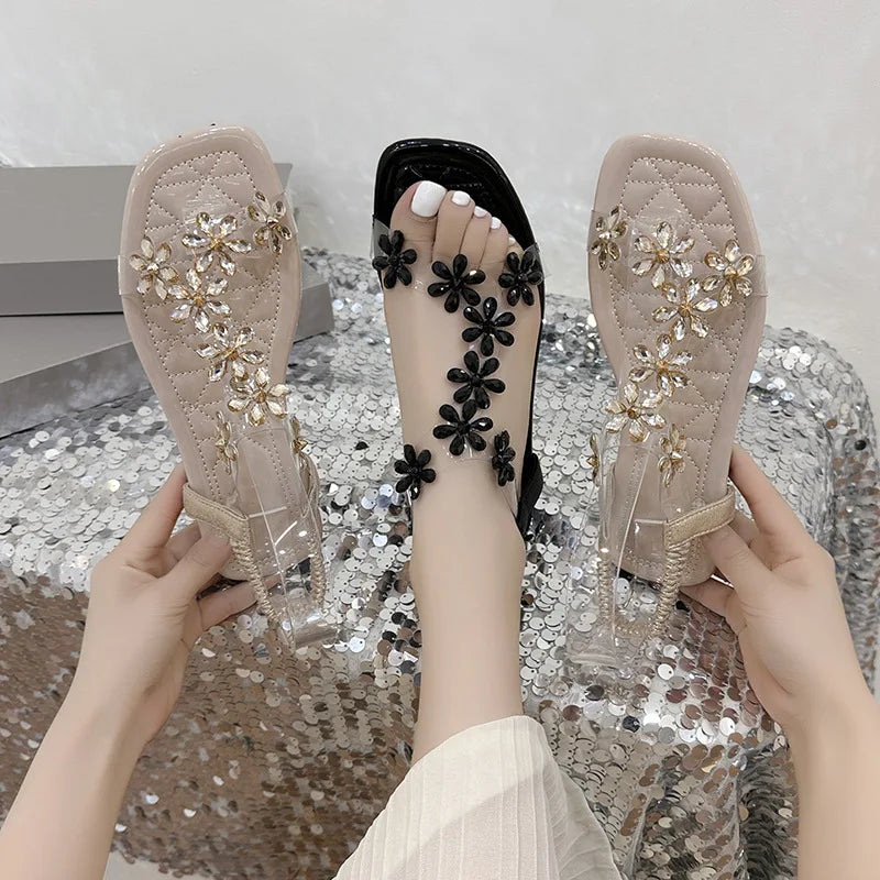 A pair of women's square-toe flat sandals, stylish silver sandals adorned with floral decorations 2026